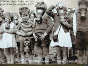 old photo children holding gas masks