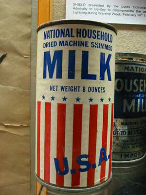 tin of dried milk from USA net weight 8 ounces